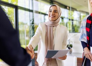 Business people sealing a deal with a handshake.