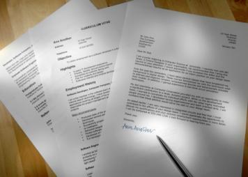 Printed written examples of a resume and cover letter with fictional information