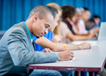 Young Black man taking a test 