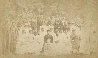 Black and white photo of a group of Black people dressed up celebrating Juneteenth