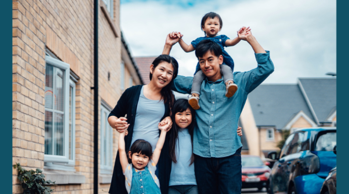 Asian family standing together, mom, dad, and three kids