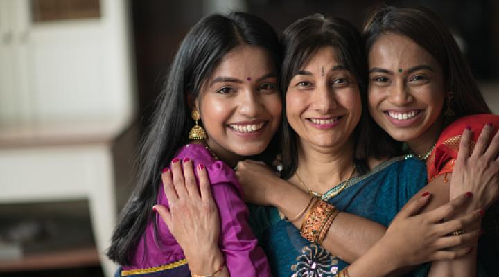 Portrait of an Indian Mother Embracing her Daughters