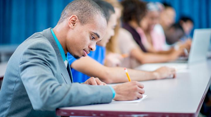 Young Black man taking a test 