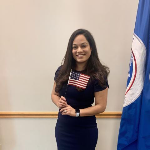 Woman holding small American Flag
